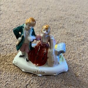 Vintage Porcelain Figurine with Red and Green Accents